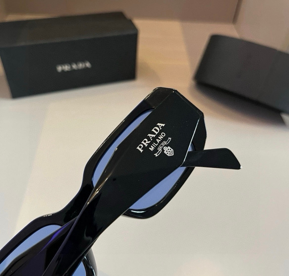 Prada Black Rectangular Sunglasses with Blue-Tinted Lenses