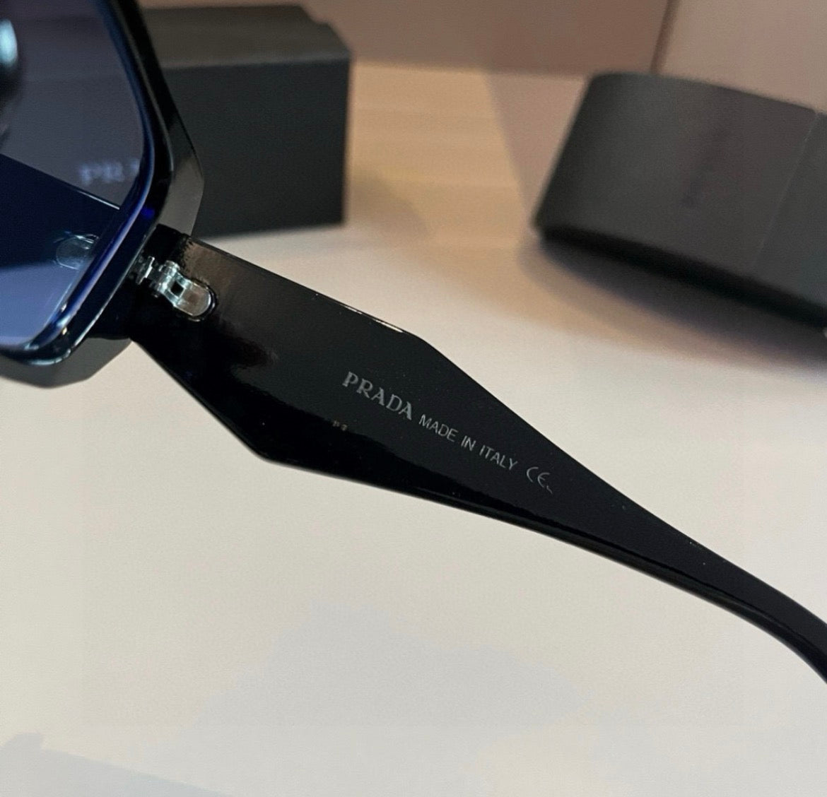 Prada Black Rectangular Sunglasses with Blue-Tinted Lenses