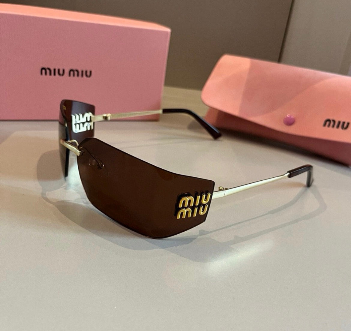 Miu Miu SMUA54 Clear Rimless Oval Sunglasses