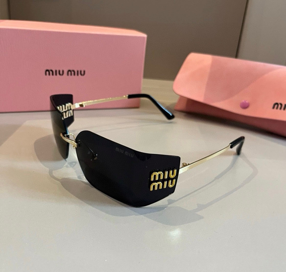 Miu Miu SMUA54 Black Rimless Oval Sunglasses