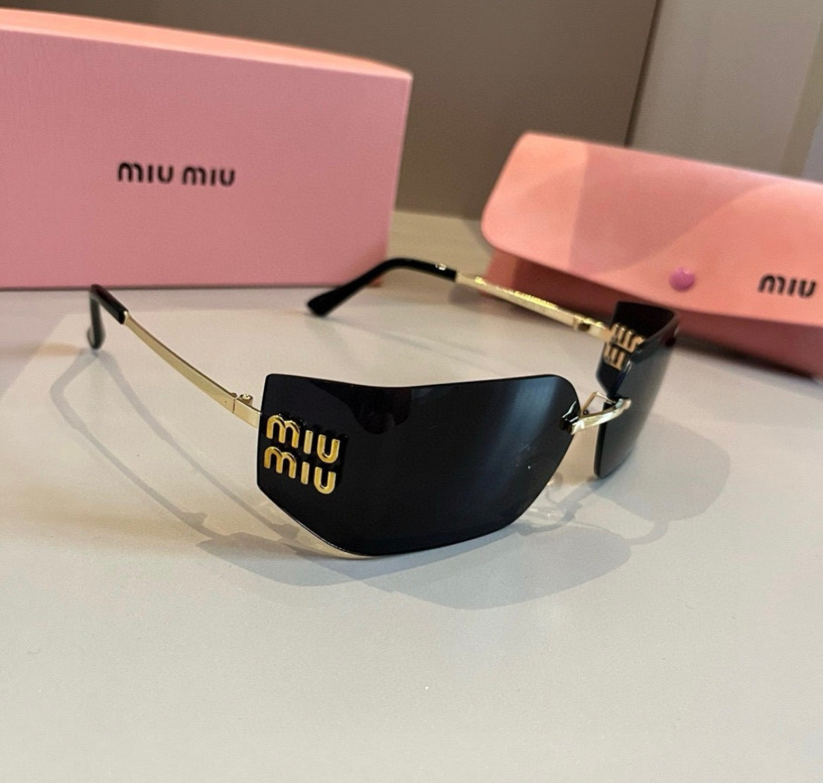 Miu Miu SMUA54 Black Rimless Oval Sunglasses