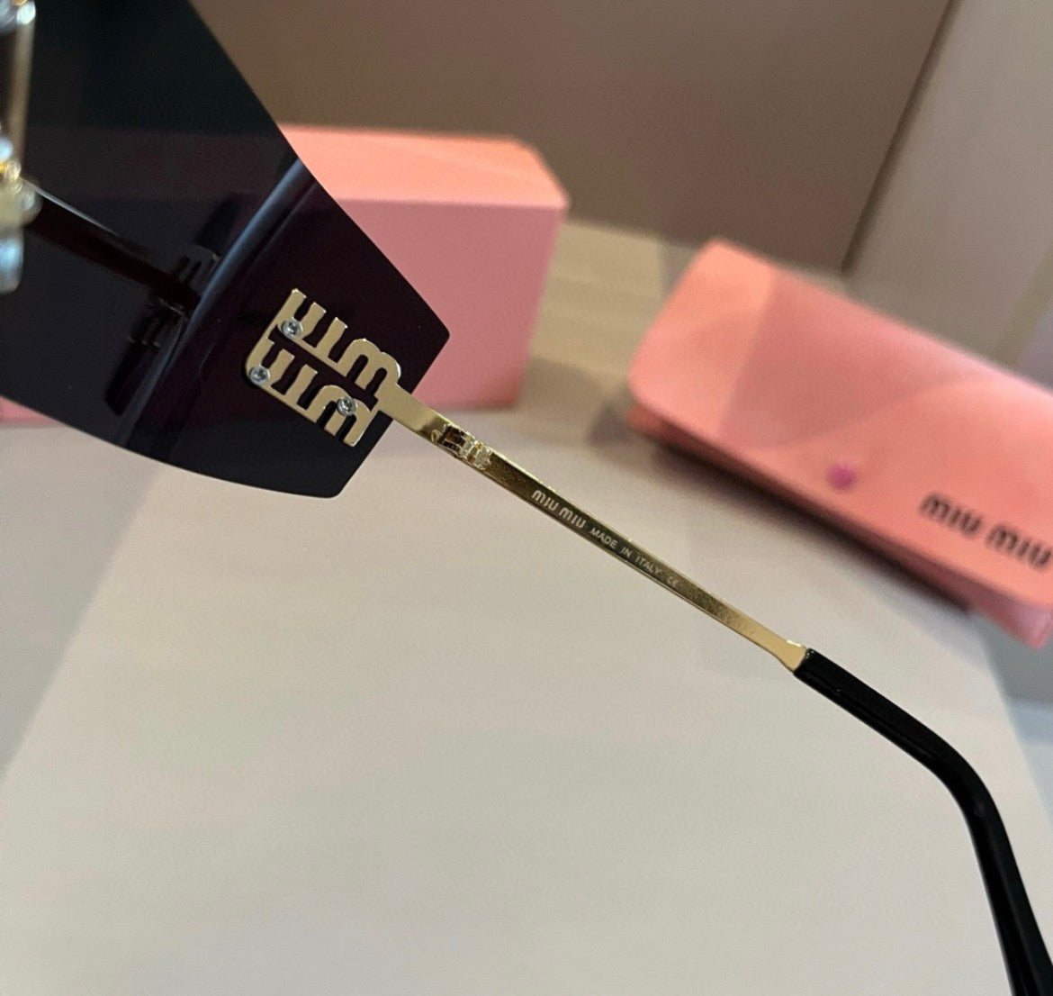 Miu Miu SMUA54 Black Rimless Oval Sunglasses