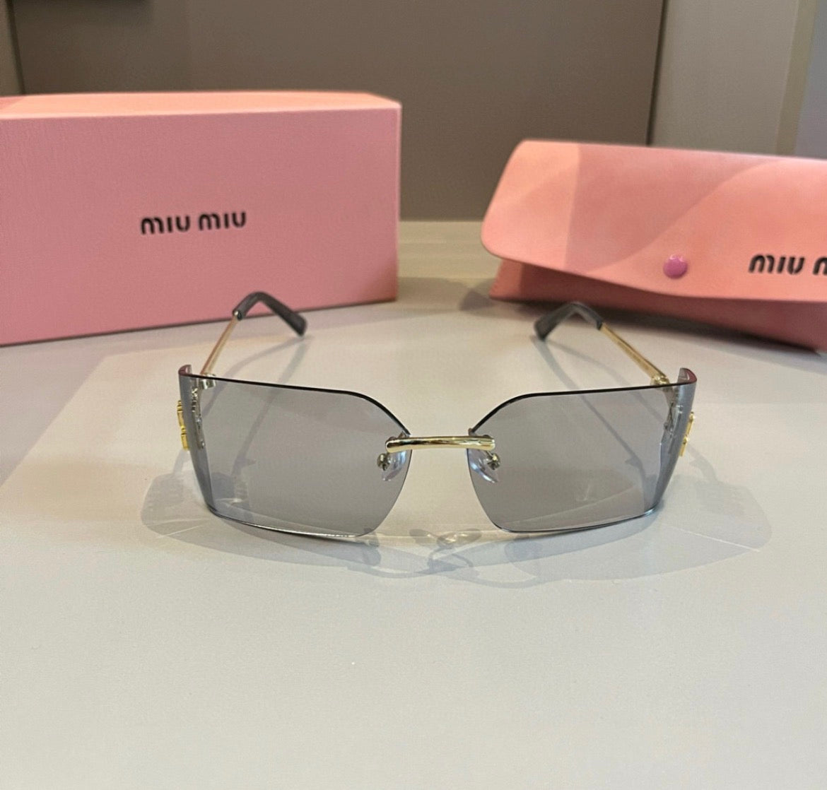 Miu Miu SMUA54 Clear Rimless Oval Sunglasses