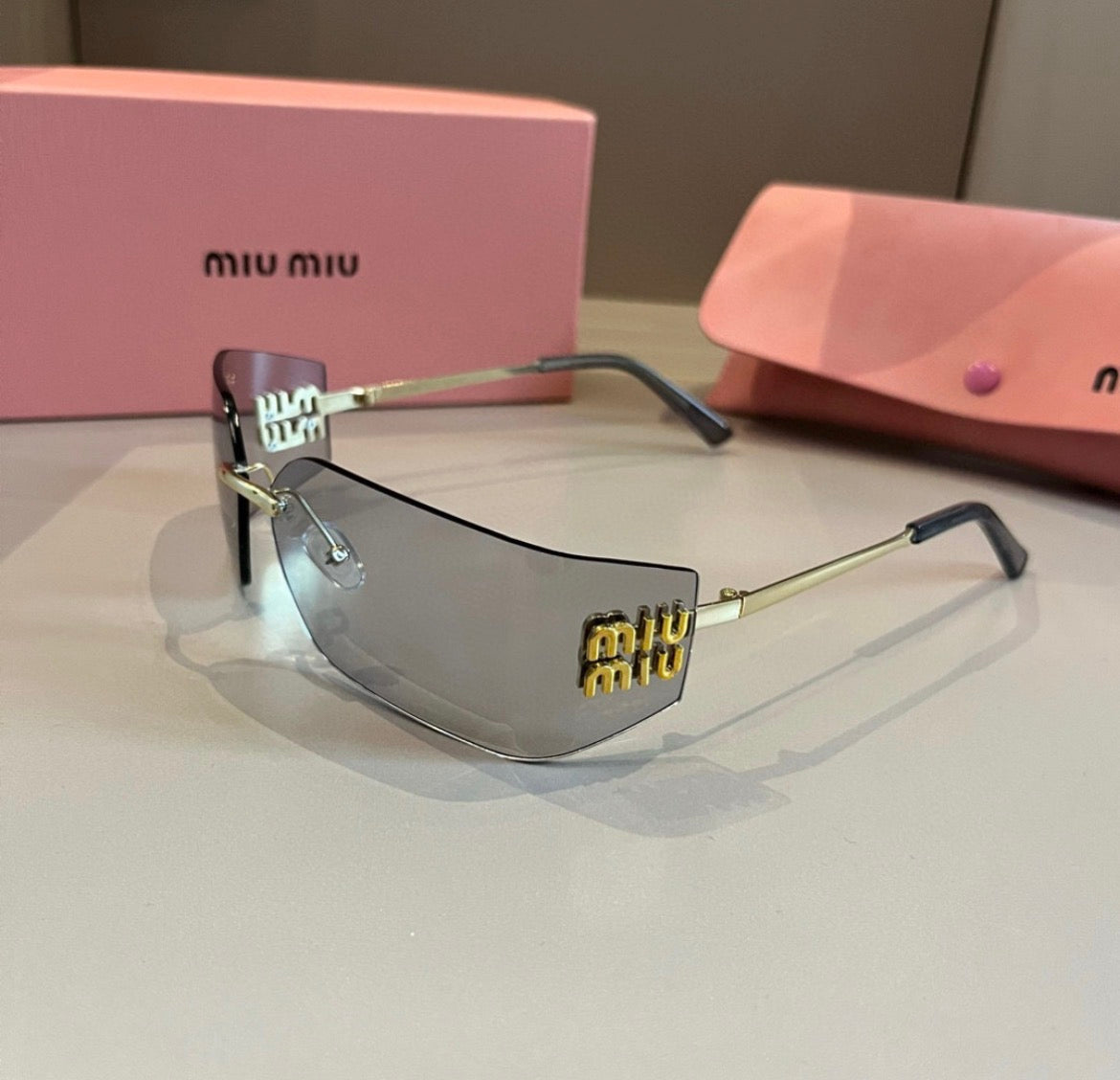 Miu Miu SMUA54 Clear Rimless Oval Sunglasses