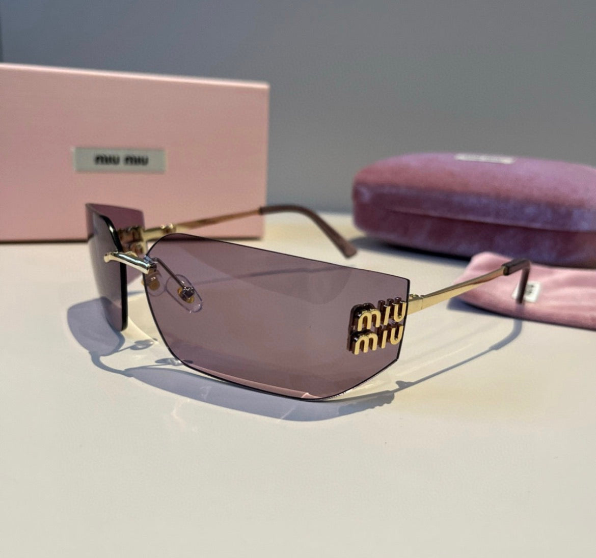 Miu Miu SMUA54 Brown Rimless Oval Sunglasses