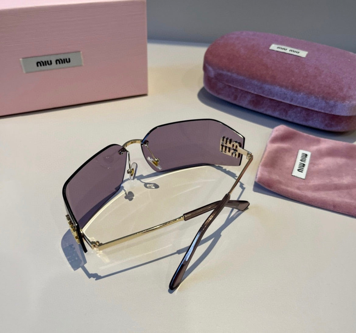 Miu Miu SMUA54 Lavender Rimless Oval Sunglasses
